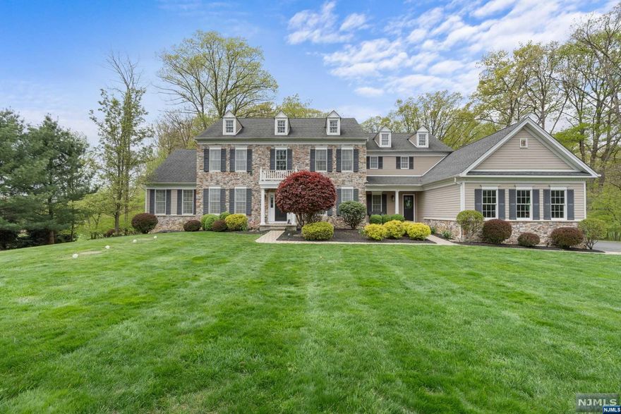 Welcome to 160 Flanders Netcong Road! This stunning Toll Brothers Coventry Manor sits set back on a lovely acre of land backing up to woods! An absolute massive yard that's private and perfect for entertaining large groups. The house itself boasts almost 5,000 square feet PLUS a massive unfinished basement for value add. This home features 4 large with 4 bathrooms en suite. The master also features a living room-sized sitting room! The expanded kitchen features stainless steel appliances, a pantry, an oversized center island with a breakfast bar, and amazing views of the woods. Seamless hosting with a drop-down living room that leads to a tree deck. Besides the home, this location has top schools, minutes to Budd Lake and Lake Hopatcong, and super quick access to Rt 46, 80, 206, & 287. Be sure to make an appointment today before it's gone!