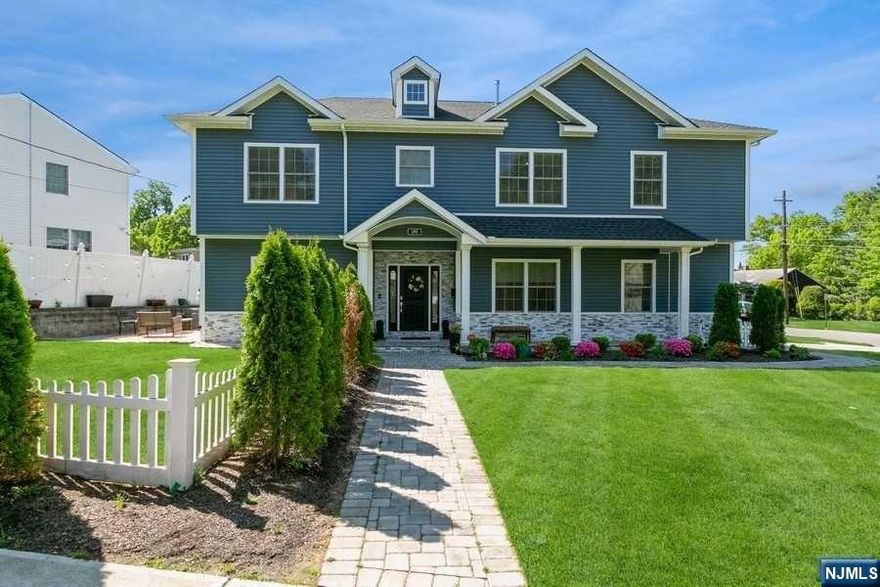 Beautiful 5 bedroom, 3.5 baths custom colonial with front porch features large living room with fireplace, dining room that opens to large gourmet kitchen boasting custom cabinets, high-end appliances, center island with quartz countertops, butler's pantry and wine cooler. Primary suite with tray ceilings, walk-in-closets, soaking tub, tiled shower with frameless glass doors and rain shower jets, on second floor along with three additional bedrooms, a full bath and laundry. Full finished basement with large rec area, bedroom and full bath. Built in 2020 on old foundation this home has many modern amenities including I/G sprinklers, video intercom system and close to NYC transportation, top rated schools and houses of worship, this is a home not to miss!!