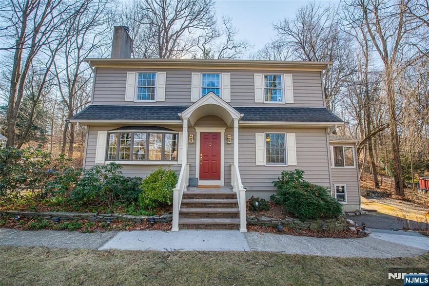 Welcome to this 4-bedroom, 3-bath colonial perfectly situated between the desirable Cupsaw and Erskine Lake neighborhoodsâ€”where charm meets convenience! This timeless home features original and classy details throughout, including a spacious living room with a cozy wood-burning fireplace, a formal dining room, and a bright eat-in kitchen. The first-floor Great Room/Sunroom is a showstopper, with light wood paneling, soaring ceilings with skylights, wall-to-wall windows, and direct access to the deck and backyardâ€”ideal for relaxing or entertaining. Upstairs, three sun-drenched bedrooms offer comfort and style. The primary suite boasts a walk-in closet, additional storage, and a private en suite bathâ€”your personal retreat. Enjoy peaceful outdoor living on the private deck surrounded by natural wooded beauty. The unfinished, walk-out basement is awaiting a personal touch - perfect for a home office, gym or family room. Donâ€™t miss this special Ringwood gem!