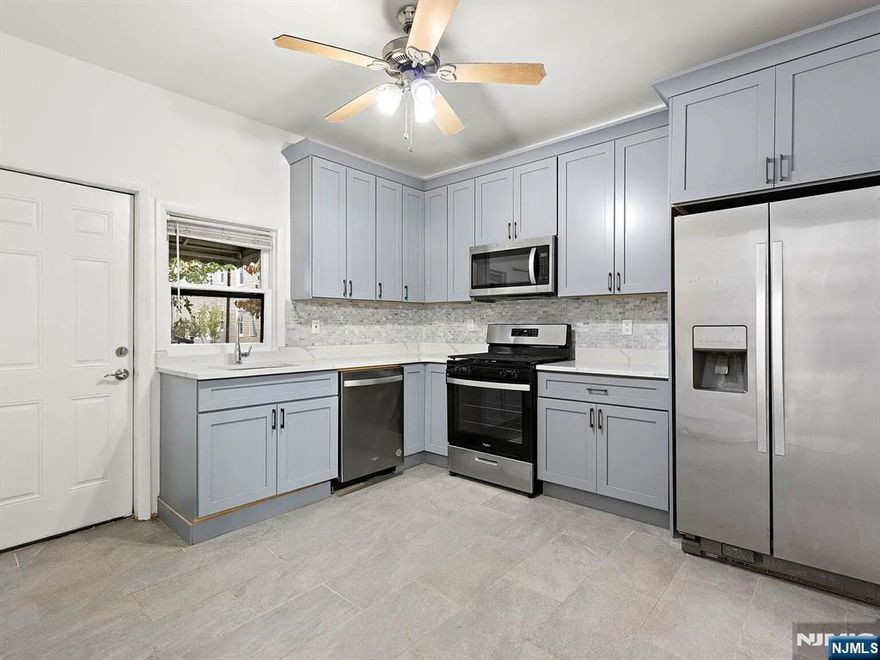 Fully renovated 1st Floor Unit - A 3 Bedroom Apartment with Living Room, Dining Room, Kitchen and 3 bedrooms with a full bath. Hardwood floors and tiled with brand new cabinets in the stunning kitchen. Tenant responsible for heat, hot water, gas, and electric. Application, tenant background check, good credit, & proof of ability to pay rent required. Pets conditional.