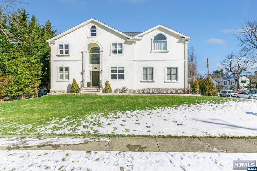 Presenting a stunningly renovated gem in Closter, NJ, this home is the epitome of modern elegance combined with comfort. Built in 2000, it's like new with extensive renovations including a sleek kitchen, luxurious bathrooms, new siding, and new hardwood floors. The main floor boasts an inviting entry foyer, spacious formal living and dining rooms, a family room with fireplace, a well-appointed kitchen, guest suite, powder room and laundry, alongside the two car garage. The second floor features large primary suite with walk-in-closet, junior suite, and two additional bedrooms sharing full bath. The fully finished basement is a highlight, offering a high ceiling, a gym, a recreation area, and extra storage space. Outside, the private backyard is a serene retreat. Located at one of Closter's most picturesque streets, and near a renowned blue-ribbon school, this home is a perfect blend of luxury and comfort.