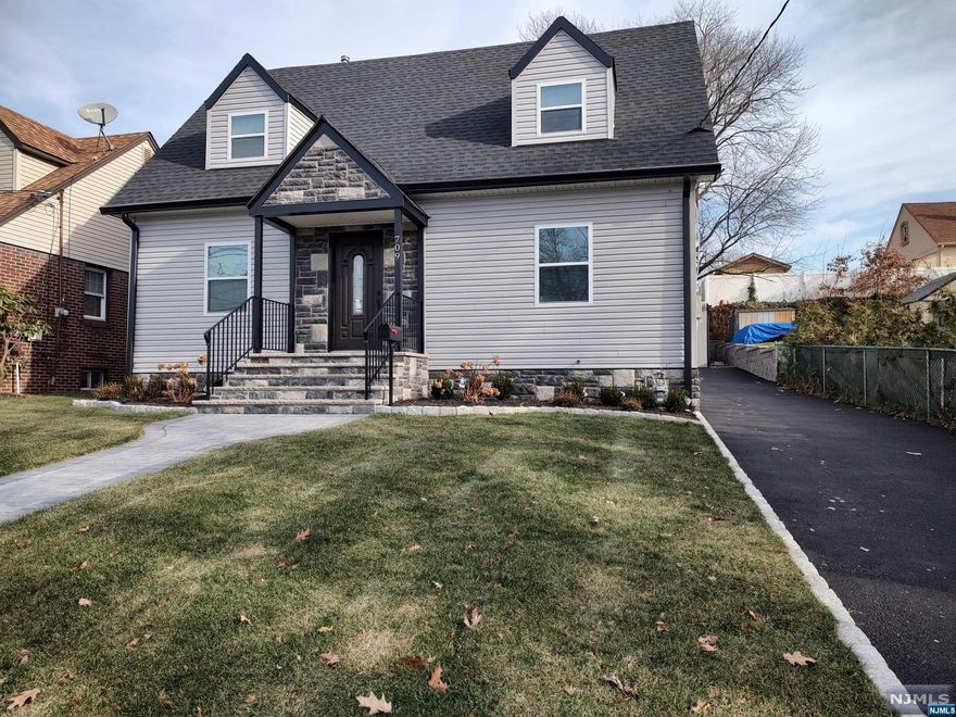 Totally renovated,extended 4 bedroom and 2 bathroom cape with detached oversized garage & finished, walk out basement. First floor offers: open concept with living room & eat in kitchen with stainless steel appliances & quartz countertop, plus 2 good size bedrooms with closets. Second floor offers 2 specious bedrooms with walk in closets & another full bathroom. Both bathrooms have quartz finished walls & floors and glass shower enclosures. Central air has 2 zones: basement,1st floor & 2nd floor. Outside offers: beautiful landscaping with sprinkler system in the front & in the back, private patio, huge garage, new driveway with parking spaces. Finished walk out basement with utility sink & washer/dryer hookups.