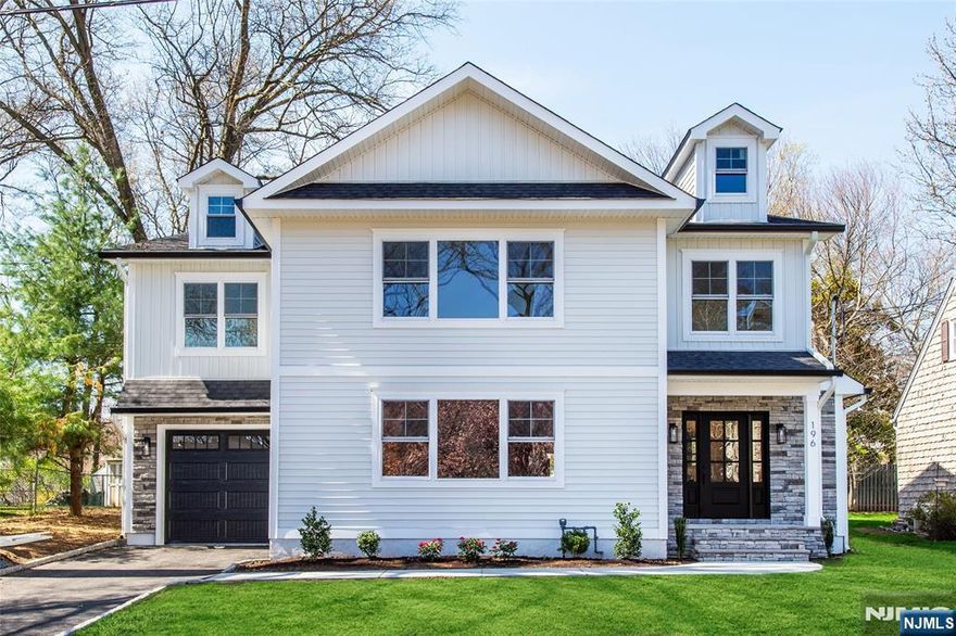 Location, Location, Location! Welcome to this stunning custom new construction Colonial, rebuilt from the foundation up, offering approx. 4,000 sq. ft. of beautifully finished living space. Nestled on a charming horseshoe street in a desirable neighborhood, this home is a short walk to the park and minutes from the train, downtown, and major highways perfect for convenience and lifestyle.Step inside the welcoming foyer that opens to an expansive living room with an oversized fireplace. The show-stopping chef's kitchen features a waterfall quartz island, Thermador appliances, wine refrigerator, and spacious pantry. The open layout flows into the dining area and family room with a second fireplace, ideal for everyday living and entertaining. Sliding doors lead to a private backyard, creating a seamless indoor-outdoor flow. A first-floor bedroom or office with full bath adds flexibility.Upstairs offers five spacious bedrooms with en-suite & Jack-and-Jill baths along with custom closets. The primary suite boasts vaulted ceilings, dual walk-in closet, and a spa-like bath. Laundry on second floor adds to ease of everyday living.The finished basement provides bonus space for recreation, fitness, & additional living. Built energy efficient with EV charger in garage. Don't miss this exceptional Fanwood home. Schedule your private showing today.