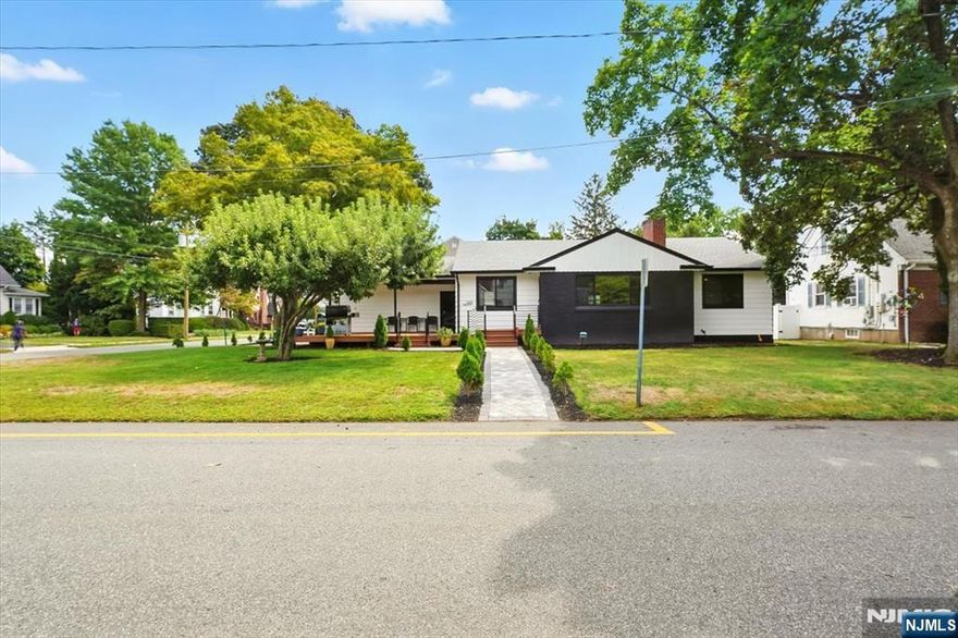 Midcentury Modern Gem with Timeless Curb Appeal! This beautifully renovated ranch blends clean midcentury design with custom upgrades throughout. From Andersen windows to a Tesla Powerwall and solar panels, every detail reflects quality craftsmanship. Enter from the 400 SF composite deck into a sunlit living room with refinished hardwood floors, a wood-burning fireplace, and an open dining area. The renovated kitchen features quartz counters, stainless appliances, and custom cabinetry. The expanded primary suite offers generous space, while the guest room is bright and inviting. A 1,200 SF unfinished basement includes plumbing for a future bath and an upgraded electric panel. Additional updates: new roof, gutters, AC, walkways, widened paver driveway, smart-home features, and solar energy efficiency. Set on a quiet, tree-lined street near Whole Foods, shopping, transit, and major highways, this move-in-ready home perfectly combines timeless style and modern comfort.