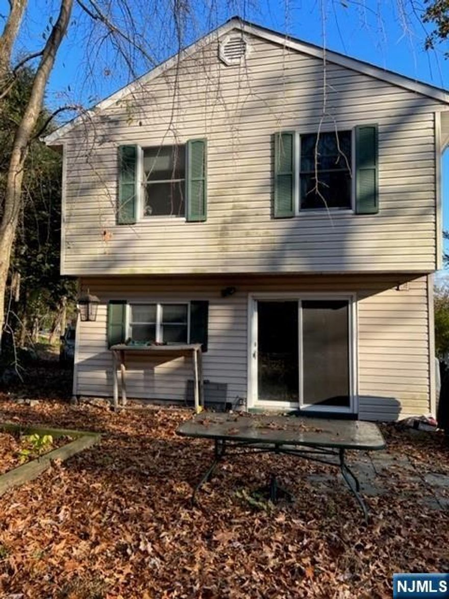 cabin style with 2 bedrooms on second floor. The property is located on a dead-end street in lower West Milford. The property backs to Green acres(Optional Lake privileges). Wood-burning stove as is. Home is being sold As-is. The septic tank needs repair leech field needs repair . Annual fee 100 The short sale has been approved at the listing price, and the property is being sold as-is.