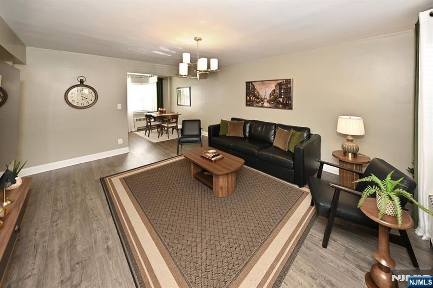 Beautifully updated & immaculately kept 2 BR first flr condo in desirable Suburban Terrace Complex! Located next to the Maywood border this great location is close to everything including NYC Bus a block away, shops, restaurants, schools, parks and malls! This modern, updated unit has a terrific open design from living rm to dining area to kitchen with new luxury vinyl flooring, (hardwood under if preferred) and is fully painted throughout. Both BRs are good sizes and the primary BR is large to accommodate a kingsize bed. Kitchen & bathroom both recently updated! Larger square footage than most units, this feels spacious and will be a pleasure to call your new home! Also includes 2 parking spots outside, and can have a full covered garage for an extra fee. And PETS OK !!! Open house sunday from 1-3pm. DO NOT MISS THIS ONE ! Move right in to one of the nicest units in this complex - Must See !!