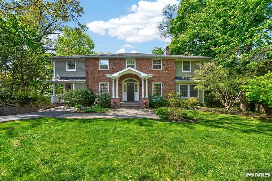 Timeless elegance defines this Center Hall Colonial, where classic architecture meets thoughtfully designed living spaces. A gracious foyer introduces beautifully scaled formal rooms, including a refined living room with fireplace and an elegant dining room ideal for entertaining. A possible first-floor guest suite or dual home office and a convenient first-floor powder room add flexibility and functionality for todayâ€™s lifestyle. The expanded chefâ€™s kitchen and adjoining family room form the heart of the home, enhanced by radiant heated floors, vaulted ceilings, and a striking wood-burning fireplace with gas starter. French doors open from the family room to a Trex deck, creating seamless indoor-outdoor flow. Upstairs, the serene primary suite offers a private retreat, accompanied by three additional well-appointed bedrooms and the convenience of a second-floor laundry room. The finished walk-out lower level with a fireplace, provides exceptional bonus space for recreation, work, or relaxation. With its gracious flow, refined details, and inviting ambiance, this exceptional home offers comfort, character, and timeless appeal- ideally located just moments from Ridgewoodâ€™s vibrant downtown, including restaurants, shops, top-rated schools and convenient access to NYC via train and bus.