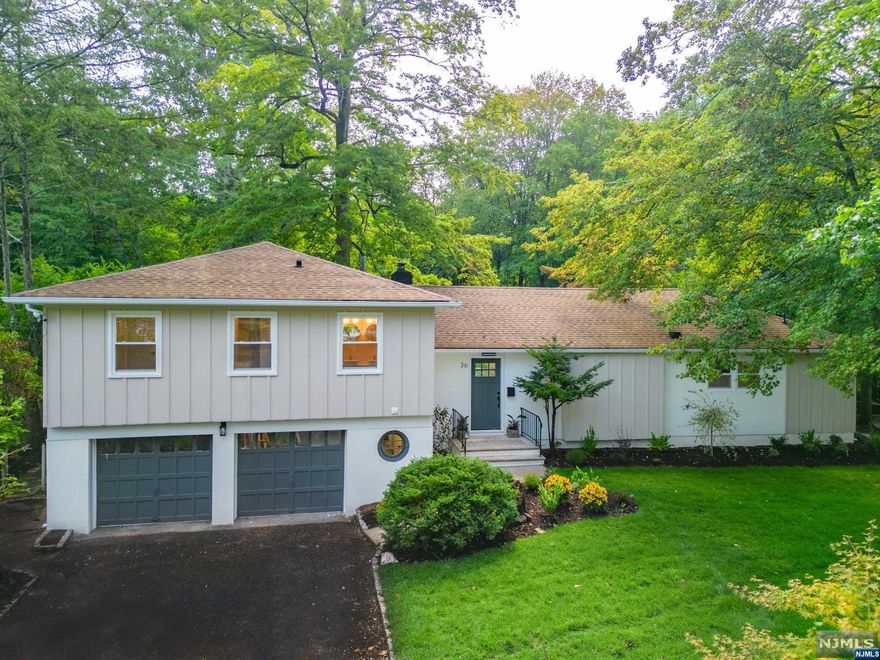 Nestled in Livingston's serene streets, 36 Heron Road embodies refined living. Meticulously renovated to superior standards, it blends opulence with tranquility, creating an unmatched lifestyle. Enter to find modern elegance melded with classic charm, showcased by the sunlight drenched living room & kitchen complete with designer fixtures. The chef's kitchen features custom cabinetry from FORM Kitchens - engineered at a cutting-edge factory in Germany, by Europe's foremost kitchen manufacturer. Dacor appliances, and an innovative induction cooktop complete the bespoke finishes. Entertain elegantly in the open concept space with backyard views. The home sits on an expansive property enveloped by lush landscapes, offering natural seclusion. The babbling brook and wooded backdrop enhance relaxation on the patio. Convenient yet peaceful, it provides easy access to Livingston's vibrancy and NYC for commuters.