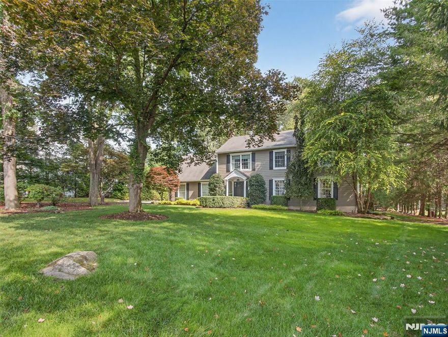 Modern elegance meets classic design in this fabulous Colonial, ideally located in the sought-after Sicomac section of Wyckoff. An inviting covered entry and spacious foyer set the tone for the open flow and generously sized rooms, perfect for both everyday living and entertaining. The main level features a well-designed kitchen with a seated island and sun-filled breakfast nook, seamlessly opening to the family room with a gas fireplace. A grand living room and formal dining room complete this warm and welcoming space. Enjoy effortless indoor-outdoor living with direct access to the bluestone patio and private backyard. Also on Main level is a Powder Room. Upstairs, the luxurious primary suite offers a sumptuous bath, two walk-in closets, and a versatile office or gym space. Three additional large bedrooms, a full bath, and a convenient laundry room complete the second level. The finished basement provides even more living space with a family room, gym area, and abundant storage. Additional amenities include HardiePlank exterior, hardwood floors, central vacuum, two-car garage, in-ground sprinklers, public sewer and much more. Enjoy all this home has to offer and Excellent Wyckoff Schools, NYC Trans. Come see this home today!