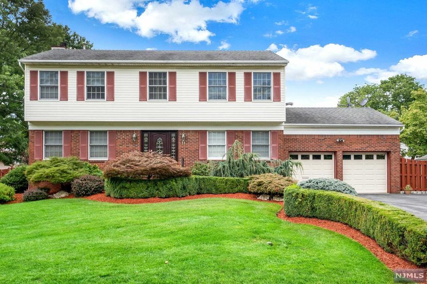 Sprawling entertaining spaces flow from the gourmet kitchen to the private fenced in yard.This immaculate, impeccable colonial is just what you have been hoping for.The great room w/fireplace & glass doors to the dining room, wet bar, tremendous chef's kitchen, sliders to a composite deck, main level home office/bedroom, garage entrance and mudroom are just a few of the fabulous features this wonderful home offers. Spa-like master bathroom, full size attic, 4 large bedrooms are all located on 2nd level. The walkout lower level offers a rec room, more office/storage space & a bonus wine cellar.More features include inground sprinklers, newer hot water heater, HVAC & furnace less than 10yrs, 2 sump pumps, wood floor, skylights & tons & tons of storage! Conveniently located!