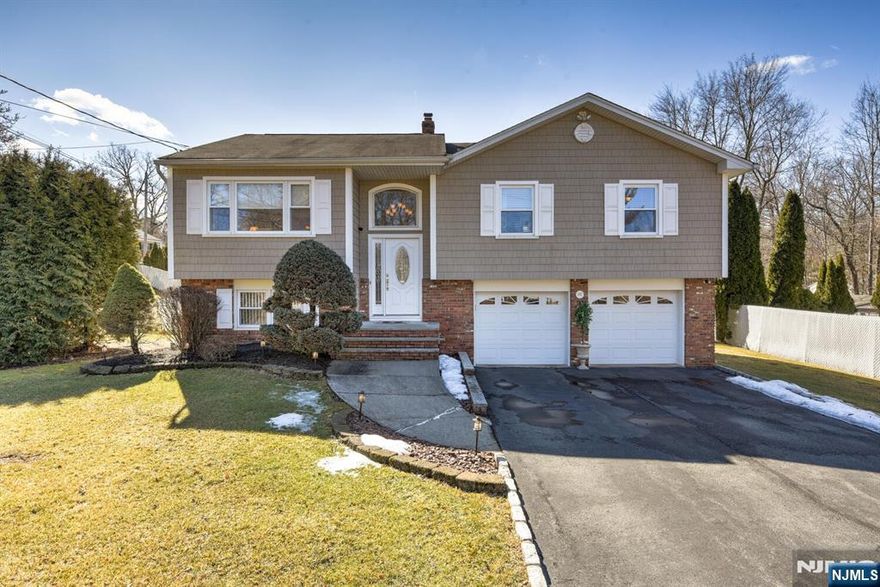 Experience "Move-in Ready" at its finest! This beautifully renovated 3-bedroom, 2-bath home with a 2-car garage and a built-in pool is perfect for outdoor entertaining. As warmer weather approaches, the backyard is ready to shine! Inside, you'll find an updated kitchen and baths, baseboard hot water heat, and central AC for year-round comfort. Step outside onto the Trex deck with maintenance-free vinyl railings. Plus, a brand-new hot water heater adds to the home's many updates. Don't miss this one!