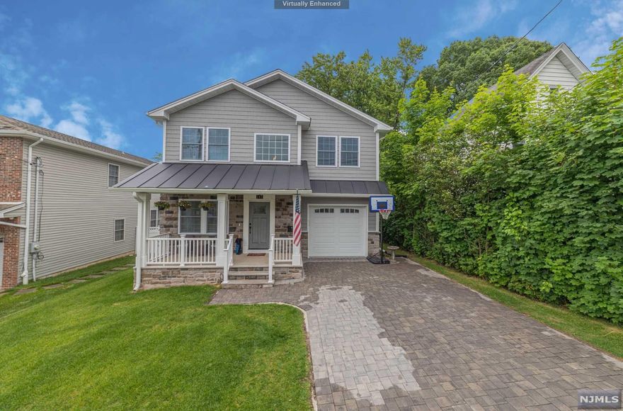 Stunning colonial home on tree lined street in desirable Hasbrouck Heights. This home has it all. The first floor features an open concept floor plan with a two story entry foyer, living room, dining room, wet bar, family room, half bath, and mud room leading to an attached garage. The expansive kitchen has white shaker cabinets, quartz countertops, with a large center island for entertaining and stainless steel appliances. Beautiful wooden staircase leads upstairs to 2 great sized bedrooms with ample closet space, a separate junior suite with a private bath great for guests, laundry room, and a private master oasis with vaulted ceilings, walk-in closets, office, and expansive master bathroom with jets and rainfall shower. The basement is full and finished for additional living space with a.5 bath. Finally the backyard is an entertainer's dream. Large fenced in heated pool with expansive patio areas and privacy.