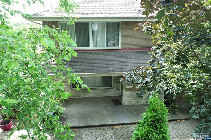 WELL KEPT 6 OVER 6 TALL BRICK TWO FAMILY WITH FINISHED BASEMENT