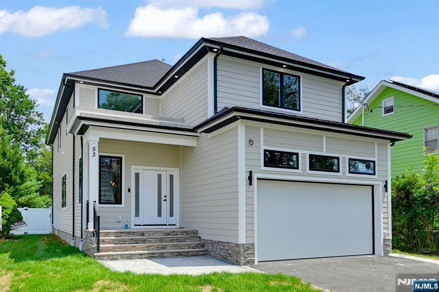 Stunning NEW CONSTRUCTION COLONIAL home offering approx 4,400 sqft of luxurious living space across 3 floors with FENCED Backyard. This 6 bedroom, 5 bathroom residence is a true gem. As you enter through the covered entry porch, you are greeted by a Two-Story Foyer that sets the tone for the open and airy layout. The home features a large kitchen equipped with custom cabinetry, high-end stainless steel appliances, walk-in pantry and luxurious quartz countertops. The large island is perfect for casual dining and entertaining. The kitchen seamlessly flows into the Living/ family room, which boasts a cozy fireplace & sliding doors lead out to the expansive Flat backyard, ideal for enjoying the outdoors. The first floor also includes an ensuite bedroom, perfect for guests or as a private office space. Upstairs, you'll find four additional bedrooms and a dedicated laundry area. The primary suite is a true retreat, featuring a PRIVATE BALCONY, two walk-in closets and a spa-like bathroom complete with a stall shower, soaking tub, and double vanity. Three additional bedrooms, one with an en-suite bath. The fully finished basement adds even more versatility to this home, featuring an additional bedroom, full bathroom, a generous recreation room, perfect for entertaining. Ideally situated just steps from public transportation to NYC, and within walking distance to the town pool and fields. 10-Year Builder Warranty