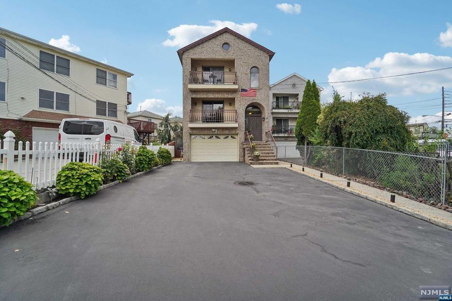 Welcome!!! TO THIS RARE OPPORTUNITY TO OWN!!! A newer, well-maintained, large, two-family home conveniently located in the sought-after Ironbound section. Everything is just steps from your door. Ironbound Restaurants/Ferry Street Shopping Stores / Nightlife, and local recreational Parks, while close to all major public transportation, Newark Penn Station with an "EASY NYC COMMUTE' Features: Open Floor Plan concept, First-floor, kitchen has a Center Island, dishwasher, garbage disposal, living and dining room, with spiral Staircase connecting to the Recreation room. Three bedrooms and two full baths. The master bedroom has a sliding door leading to the large deck with access to the backyard, the private bath has a bidet, Second floor Living room has and skylight, a kitchen, a living/Dining room three bedrooms two full baths. Hardwood floors throughout the entire house, the laundry room is at ground level for both units, recreation room has a half bath and tiled flooring