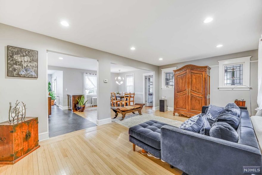 Spacious, bright, updated home with incredible curb appeal and inviting porch. Open concept on flowing 1st floor affords easy hosting/ entertaining capabilities. Patio and tasteful plantings in yard. Extra large 1st floor bedroom or Home office. Exercise room, partially finished attic space yields more storage room or as a play/ Great room. Spa-like bathroom, Updated bathrooms and kitchen. Walking distance to Houses of Worship, parks, shopping, and restaurants. Easy commute to NYC via highways, and public transportation.