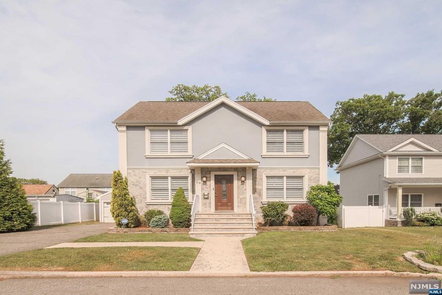 This beautiful, newer home, completely rebuilt from the foundation in 2003 and recently expanded, is just a 5-minute walk to the NYC bus stop and 1 miles from Plauderville Station, offering a one-stop express train to Manhattan. This open-concept home has a great flow with hardwood floors, a stunning kitchen with a large sit-up island, granite countertops, stainless steel appliances, and ample cabinet space. The center stairwell leads to a master bedroom with a Jacuzzi tub, two additional spacious bedrooms, and a hall bathroom. Enjoy sunsets from the new family room and balcony, accessible through French doors from an upstairs bedroom. The property includes a large fenced yard, a two-car garage with storage under the family room, and a finished walk-out basement with a rec room and laundry. With its east-facing orientation, you'll experience beautiful sunrises in the morning and sunsets in the evening.