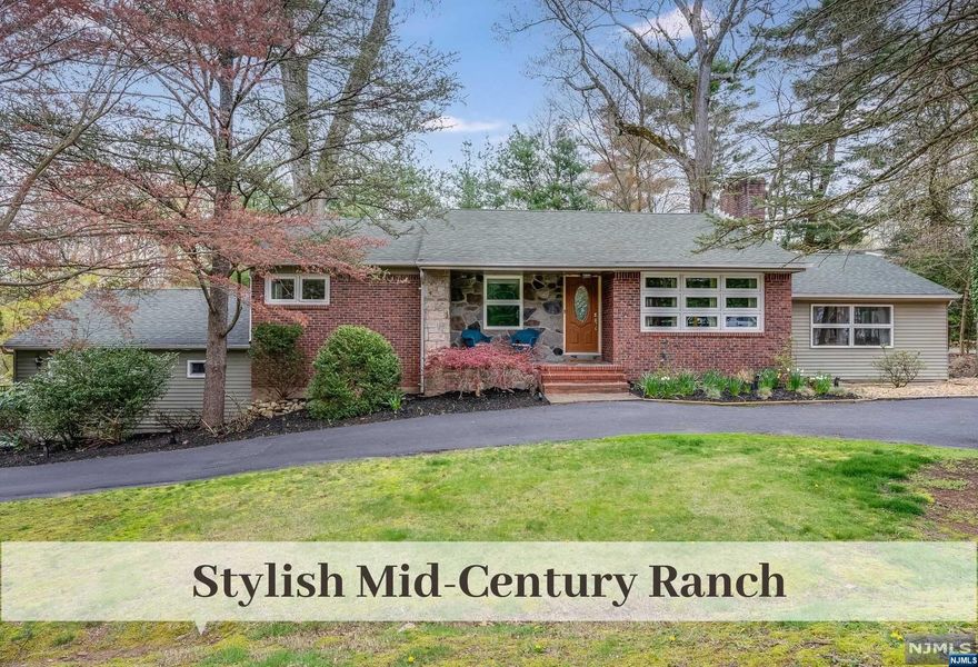 Stone & Brick appoint this Stylish Mid-Century Ranch nestled on expansive Park-Like Property offering Desirable Lifestyle Features & Generous Sunlit Spaces throughout. Upon entering, there is a sense of well-defined individual rooms that beautifully flow together in unison for lovely connected sightlines. Living Rm w New Window Set & Fireplace w Stacked Granite transitions to Dining Rm w Sliders to Dreamy Covered Porch overlooking Backyard. Kitchen offers Stainless Appliances & lrg Pantry. Outstanding Family Rm w Terracotta Flr, Vaulted Ceiling & Frplc has Sliders to Deck great for Entertaining. Bedroom Wing provides a Prim Bedrm, 2 more Bedrooms & Fresh Generous Hall Bath. Continue to the Lower Level to find a Private 4th Bedrm w EnSuite Bath perfect for Guests, Oversized Rec Room w adjacent full Kitchen Facilities, Home Gym, Laundry & Finished Storage. Moments to Woodside ES. Top Ranked Pascack Valley HS. Amazing Opportunity for your quiet private enjoyment or lrg gatherings.