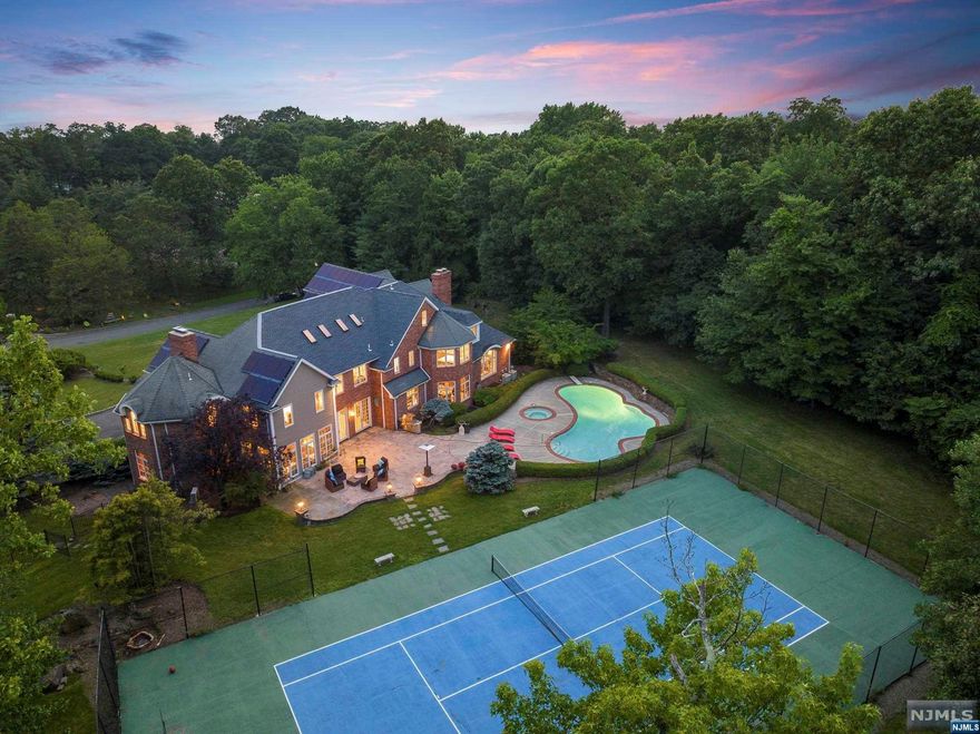 Jason Pierce 201-397-5888 and The NJProper team present: Renovated, turn key designer home on a prestigious Alpine cul-de-sac. Approx 10,000 sqft of living space. Features include 2 flat acres, tennis/ basketball court, heated pool & spa, 4 car garage, theater, automatic whole house generator, 6 suites, 4 finished floors, immediate access to Manhattan, just 11 min to NYC via GWB. High end designer furnishings and fixtures. Major renovation in 2018, new kitchen, all new bathrooms, all new floors, doors, & windows. Furniture negotiable. The VIRTUAL TOUR link for this listing contains an enormous amount of relevant information including a comprehensive video tour with hidden features & room dimensions, written description, additional photos, floor plans, and a complete interactive 3D model of the home.