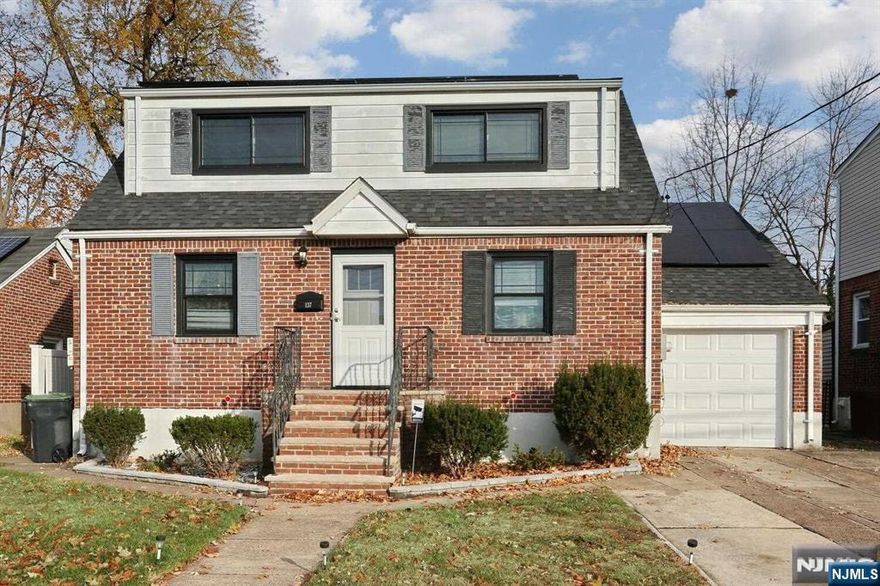 Expanded All Brick Cape on quiet street! This Lovely home has numerous features and offers great amenities including an enormous expanded first Floor Master Bedroom, Newer Central Air, a 1 Year Old Roof, Beautifully Updated Baths and Much More. The first level offers an Open Concept Living Room/Dining Room Combo with Electric Fireplace, an Updated Kitchen with Wood Cabinets, a Huge Master Suite with an oversized Closet, Motorized skylight, Vaulted Ceiling & a Desk area with a Gas Line for another Fireplace, and an Updated Full Bath. Upstairs & you will find 3 additional good size Bedrooms all with Recessed Lighting and Double closets & a Spectacular Full Bath with Glass tile, a Double Vanity and 2 medicine cabinets. There is also a new wood floor in the large upstairs Hallway. The basement offers a finished area used as a gym and a separate Laundry/Utility Area. Newer 200 amp electric and a fenced yard. Terrific location and move right in condition!