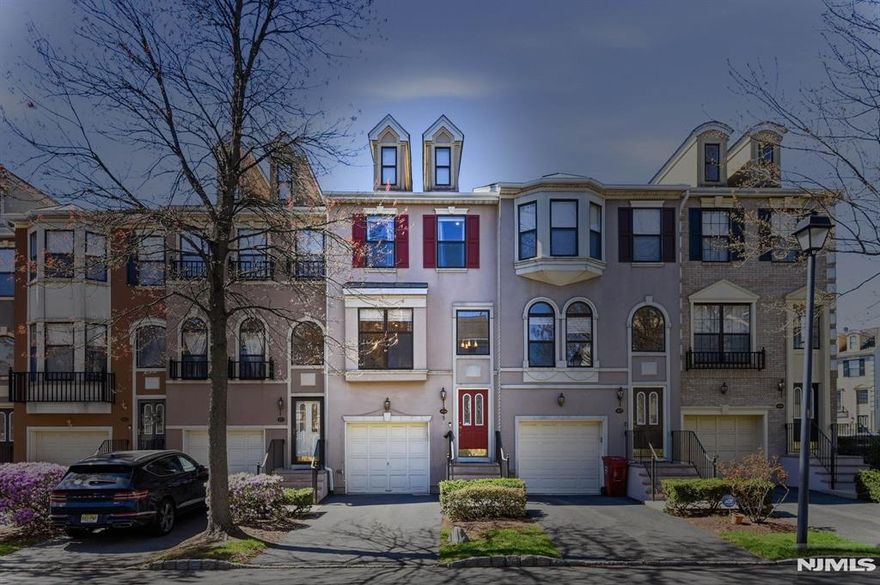 Beautifully renovated tri-level townhome in the highly desirable Cambridge Heights community, offering approx. 2,010 sq ft of light-filled living space. This turnkey home features 2 bedrooms and 3 full plus 1 half baths, including a full bath on the walk-out lower level ideal for guests, recreation, or flexible living. The main level showcases an updated kitchen (2020) with custom wood cabinetry, designer fixtures, and a center island open to the living area. A spacious family room with gas fireplace, formal dining room, powder room, and great storage complete this level. Upstairs offers two generously sized bedrooms, two full baths, laundry, and abundant closets. High ceilings and oversized windows bring in beautiful natural light throughout. The lower level provides additional living space with direct access to a private patio and outdoor area, plus access to the garage. New Roof (2026) and recent updates include fresh neutral paint, upgraded flooring (2023), new HVAC (2022), and water heater (2024).Cambridge Heights is a gated community located just 9 miles from NYC, offering a resort-style lifestyle with pool, clubhouse, fitness center, tennis courts, playground, and beautifully maintained grounds. Easy access to NYC bus, train, and major highways makes this a commuter's dream.