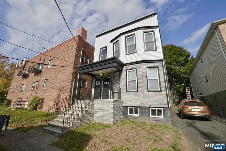 Beautifully renovated two-family investment property with private entrances for each unit. Both spacious units offer three bedrooms, a full bath, and an eat-in kitchen with generous counter and cabinet space. The inviting living rooms and hardwood floors throughout add warmth and style. A full, unfinished basement provides excellent additional storage. Each unit has separate utilities, and there is ample off-street parking in the driveway. Conveniently located near parks, restaurants, shopping, public transportation, major highways, and just a short distance to NYC. To preview this property, please call Ascensao Gutierrez at 973-207-0956