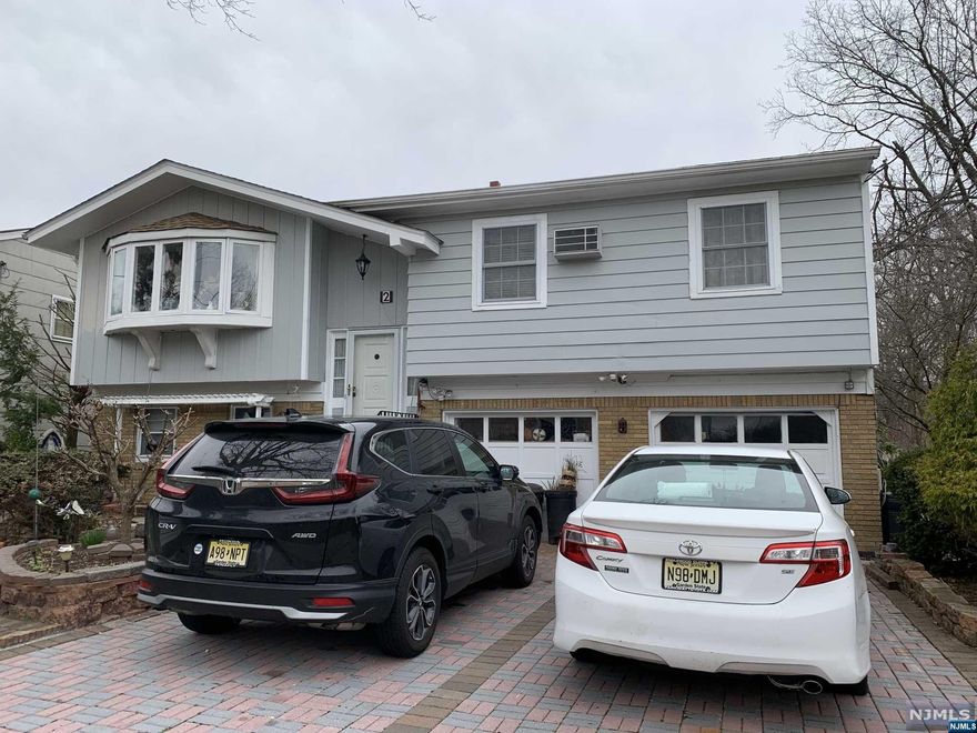 Welcome to this beautiful split level nestled in a quiet neighborhood. Bring your creativity to this open concept! Walk up to second floor to a spacious living room, formal dining room, eat-in kitchen, 3 bedrooms and 1 updated full bath. First floor has extra full bathroom and family room with wet bar that opens to deck and backyard. Ideal for entertainment or just rewinding on a weekend or a long day. Close to schools, houses of worships and public transports.