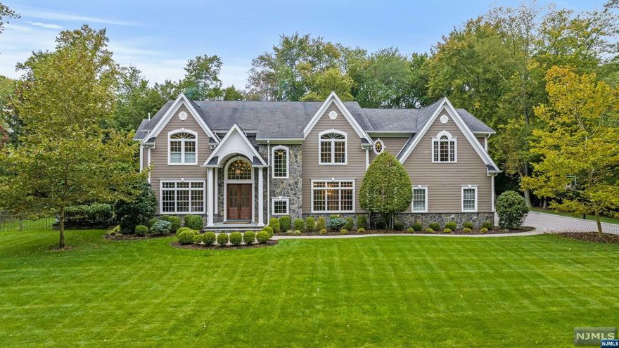 Welcome to a lavish 6BR/7.5BA farmhouse colonial in an enchanting, sought-after neighborhood! Across Approx. 6,400 sq.ft boasts a full-finished basement and full radiant heat in all rooms, all supported by a reliable generator. Features a gourmet kitchen with a Wolfe stove, marble counters, and a banquet-size dining room with butler's pantry. A stunning great room with a fireplace opens to a sublime Lanai, offering a stone fireplace, outdoor TV, pool and kitchen. Beyond lies a meticulously maintained backyard, showcasing a sparkling pool and patio kitchen, enveloped in a sprawling one-acre yard. The upper level unveils a master sanctuary with a bathroom containing a steam-enabled shower. Een-suite bedrooms, all featuring WIC. An extensive basement delivers entertainment/media areas, game/rec rooms, a bar, and an additional bed/bath, all within a top-tier school district