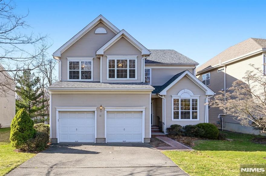 Welcome to this spacious 4 bedroom, 2.5 bath colonial style home set on a premium lot backing the reservoir, offering breathtaking year round views. This home features three levels of living space and a functional, flexible layout ideal for today's lifestyle. The main level offers a massive eat in kitchen that flows seamlessly into a sun filled great room with an abundance of windows, perfectly capturing the scenic backdrop, with glass doors leading to the deck. A private office, living room, dining room, convenient laundry room, and powder room complete the first floor. Upstairs, you will find generously sized bedrooms, including a expansive primary suite with stunning reservoir views. The home has been professionally painted throughout and features brand new carpeting, creating a fresh and move in ready feel. The fully finished basement offers approximately 1000 sq ft of additional living space, ideal for a recreation room, gym, or guest area. Additional highlights include a two car garage, newer roof, HVAC system, whole house generator, and a rare elevator for added convenience. Located in desirable Reservoir Ridge with tranquil views. This home offers incredible potential. Being sold strictly as is.