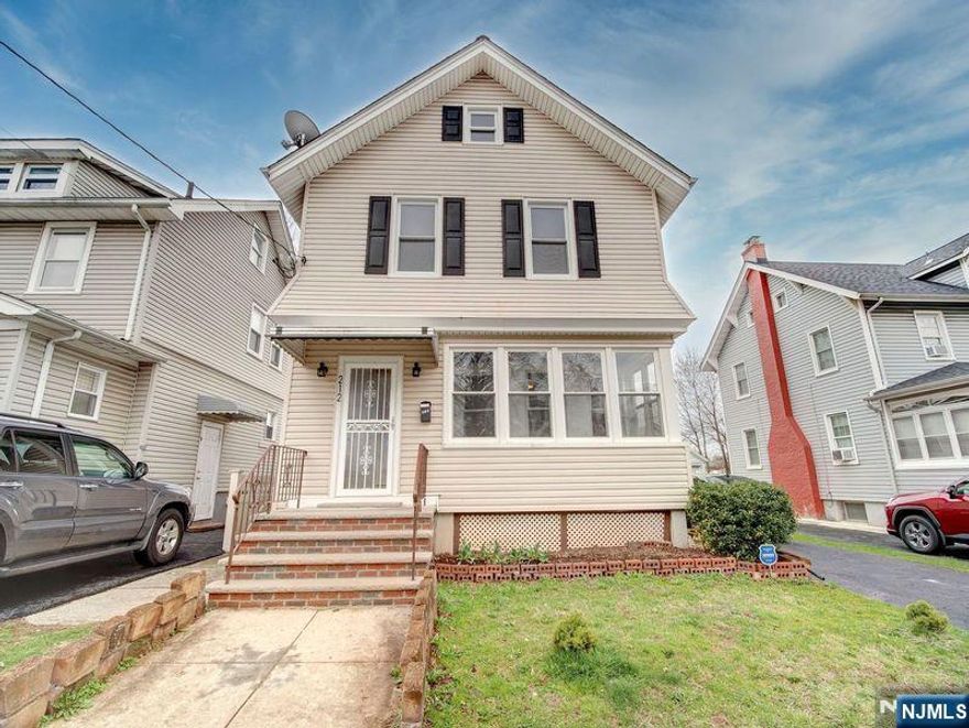 Welcome to this beautifully updated colonial single-family house with three bedrooms and 1.1 bathrooms. As you enter the first floor, you'll be greeted by an inviting enclosed porch that sets the tone for relaxation. The formal dining and living rooms are perfect for entertaining, while the bonus family room provides additional space to unwind. The modern kitchen is a chef's dream, featuring a stylish breakfast bar, stainless steel appliances, and ample counter space. Make your way to the second floor, where you'll find the primary bedroom complete with a walk-in closet and a private half bathroom for your convenience. One additional bedroom with a full bathroom is conveniently located in the hallway. The third level boasts a generously sized third bedroom. The full walkout basement provides additional space, complete with a laundry room. Step outside to your expansive backyard, featuring a large deck and ample space for entertaining, all surrounded by vinyl privacy fencing. The exclusive driveway leads to an oversized detached garage, providing plenty of room for your vehicles and additional storage. Situated in a prime location, this home offers easy access to NYC transportation, schools, parks, and shops. Don't miss your chance to own this incredible property that perfectly combines modern comfort with an unbeatable location.