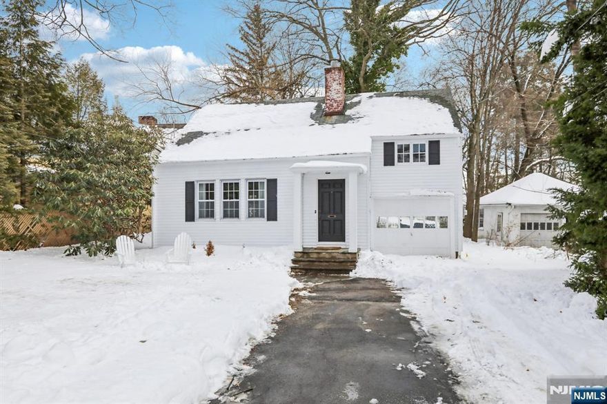 Highest and Best due Wednesday at 5PM Cottage living right on the West Side of town! Your own private lawn, your own little slice of heaven, and a price point that is rare in a Village where homes average well over a million dollars. Tucked away from the street and nestled on the property, this country cottage is the one you've been waiting for. Beautiful hardwood floors and all new windows on the second floor and living room give this home a warmth that's hard to find. The living room spans the front of the home, enjoying long views and on certain nights frames the most gorgeous evening light. A cheerful dining room with built-ins, a kitchen with newer cabinetry, stainless appliances, stone countertops and views to the backyard, plus first-floor laundry and powder room make everyday living effortless. A charming screened-in porch off the kitchen is perfect for private outdoor dining and relaxing. Upstairs the primary bedroom is generously sized with two closets, a second bedroom with plenty of sunshine, and a full bath in the hallway. Attached garage, additional storage, and a large front yard add even more options for outdoor living. More space than you'd expect, inside and out. A rare find that is move-in ready and full of potential. Close to schools, a stone's throw to downtown and trains. This home is a warm hug waiting for the next owner!