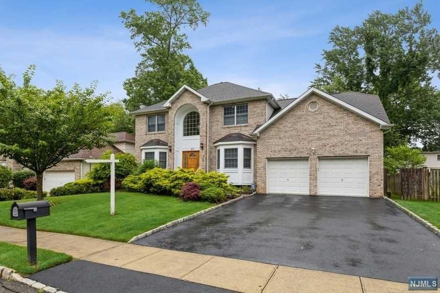 Truly impressive 4/5 bedroom 4 bath colonial on tranquil, picturesque street adjacent to South Mountain Reservation, in sought-after St. Cloud neighborhood. The main level features soaring entry foyer, formal living and dining rooms, custom kitchen with eat-in area (doors to deck), and adjoining family room with gas fireplace. The wing off the kitchen offers an office (5th bedroom), full bath, laundry room, and garage entrance. Upstairs there are 4 large bedrooms with custom closets throughout, full main bath, plus the ensuite primary bath with separate shower, jetted tub, double vanity, and walk-in closet. The huge finished basement (rec. rm., office, full bath and storage areas) and fully fenced yard with deck & patio, put this home "over the top." Close to NYC transportation.