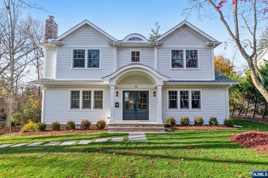 COMPLETION SUMMER 2024 - move in before school! This custom-built Colonial (existing foundation) with 5-bed/4.5-bath is designed by a renowned local architect and newly constructed by a reputable builder. Located in the heart of Ridgewood, just a stone's throw from downtown, NYC-bound train, Ridge E.S. and GWMS. Prepare to be impressed by an open layout, with a formal living room with fireplace, convenient 1st floor guest en-suite/office, gourmet kitchen with Wolf/Subzero appliances, walk-in pantry, large breakfast area, and 9' foot ceilings. Kitchen overlooks dining room & great room with cathedral ceiling, fireplace and double patio doors that open to the backyard. All bedrooms ensuite including the 2nd level primary suite with a spacious walk-in closet and a spa-like bathroom with a free-standing tub, double vanity and stand-alone shower. Finished basement, attached garage, level 0.5-acre property with room for a pool.