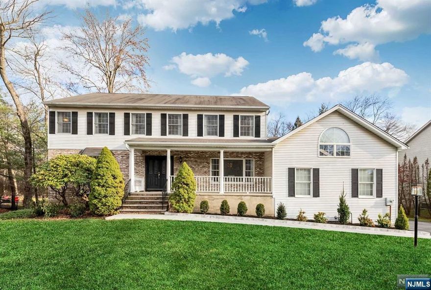 Nestled on a highly desirable double cul-de-sac in the charming town of Allendale, this 4+ bedroom center hall colonial boasts beautiful curb appeal with its welcoming front porch. This home features a classic floorplan with a spacious formal dining room, living room, family room & eat-in kitchen. The mudroom with nearby half bath and laundry offers convenient access to the backyard oasis, the attached garage or up to an amazing bonus room with skylights. Upstairs find 4 generously sized bedrooms, including a serene primary ensuite. The finished lower level provides extra living space and an abundance of storage. The backyard is an entertainer's dream complete with a large deck overlooking the in-ground pool and wooded views. All this in an amazing location close to top-rated schools, parks, downtown, NYC transportation & more!