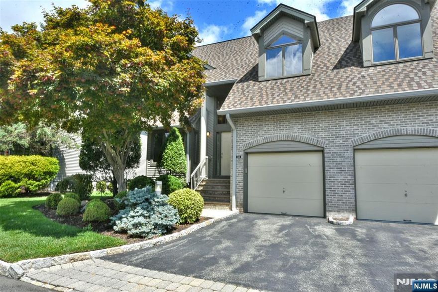 Experience the charm and elegance of this beautifully updated 3-bedroom, 3.5-bath end-unit townhome nestled in desirable Northwoods in Norwood. Enter through a grand two-story foyer into a vaulted living room with gleaming hardwood floors that enhance the bright, open feel? that extends to a lovely dining room. The custom kitchen is a chefâ€™s dream with rich cabinetry, granite counters, and premium stainless steel appliancesâ€”ideal for both daily meals and entertaining? and includes a sweet dining area too! A cozy wood-burning fireplace anchors the living area, while a wall of windows frames tranquil views of surrounding greenery. A hand-painted powder room adds a unique touch. Upstairs, the spacious primary suite is a serene retreat with dual walk-in closets and a spa-style ensuite bath. A second bedroom and full bath offer comfort and privacy. A charming balcony overlooks the living room, adding architectural interest and light. The fully finished lower level provides versatile space for a rec room, guest suite, gym, or office. Enjoy peaceful moments on your private rear deck with wooded views. As a Northwoods resident, enjoy access to pool, tennis, and clubhouseâ€”blending leisure with community spirit. This refined, flexible home offers upscale living and resort-style amenities. Donâ€™t miss your chance to make it yoursâ€”schedule a private tour today.