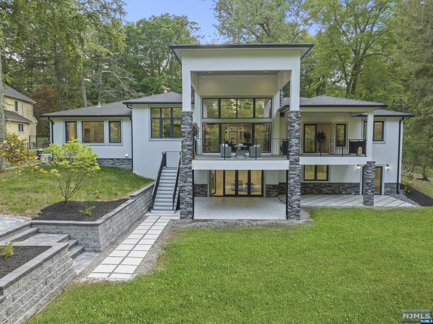 One of a kind brand new construction lakefront home in Pines Lake Community located less than 30 miles from NYC. This home features almost 6000 SqFt of finished living space located on 1.29 acres of land. The upper level features living room with a 17' ceiling, gas & wood burning fireplace and French doors leading to a deck; custom kitchen with 9' island & walk-in pantry, and oversized dining room. This level also features primary suite with private exit to deck, bathroom and 2 walk-in closets; 3 additional bedrooms, 2 full bathrooms, powder room, laundry room and mudroom. The lower level features a second independent living space with a custom full kitchen, oversized family room with gas fireplace and French doors leading to a patio, bedroom and full bathroom, making this home perfect for extended family or those that love to entertain. This level also features rooms for gym, theatre, laundry & office with a separate entrance. Enjoy Lake Life everyday!