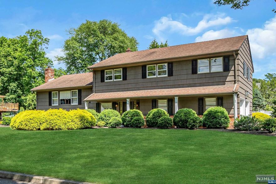 Your dream home! This immaculate split foyer, Split-Level gem blends elegance and comfort on a lush half-acre lot. Step inside and the natural light highlights gleaming hardwood floors. The oversized living room flows effortlessly into the formal dining rm. An updated kitchen features sliding glass doors that open to a lovely deck, perfect for enjoying your morning coffee or dining under the stars. The versatile ground floor includes an office (possible 5th bedroom) w/ patio access overlooking the picturesque backyard w/ mature trees, offering privacy and a serene setting. 1/2 bath, laundry. The expansive lower level features a cozy wood-burning fireplace. On the 2nd floor, a primary suite with a dressing area, en-suite bth, and walk-in closet, provide a personal sanctuary. There are 3 additional spacious bedrooms and a full bth. Lovingly cared for and cherished for many years, this home radiates warmth and charm. It's more than just a house; it's a place where memories are made.
