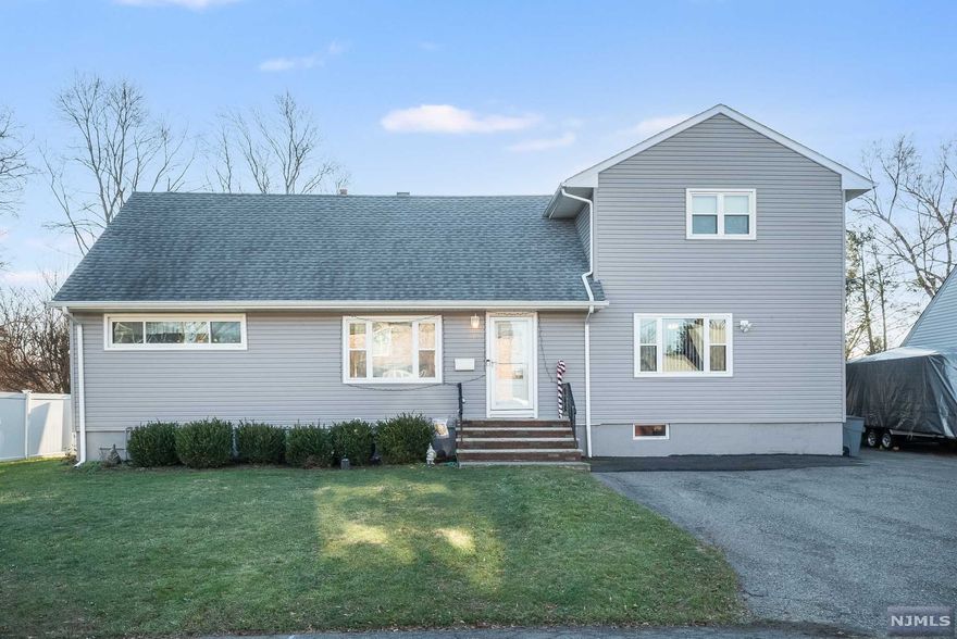 Don't miss out on this beautifully updated custom home in the heart of Wayne! Move right in with little to do but to add your own style and touches. This home offers 5 spacious bedrooms and 3 full bathrooms. The master bedroom suite has a walk in closet you can get lost in. The first floor boasts a family room, living room. dining room, two full bathrooms, 2 bedroom and a large eat in kitchen with stainless steel appliances and granite countertops. The master suite and 2 additional bedrooms are on the 2nd floor. You can enjoy the new deck and huge backyard throughout the year and add a great fire pit to the new paver patio. The basement has so many possibilities with plumbing already present to add a bathroom. Some additional upgrades are new roof, new central a/c, and new siding. The town offers excellent schools, restaurants, shops, parks, sports, easy NYC transportation and town pool and town lake like no other!