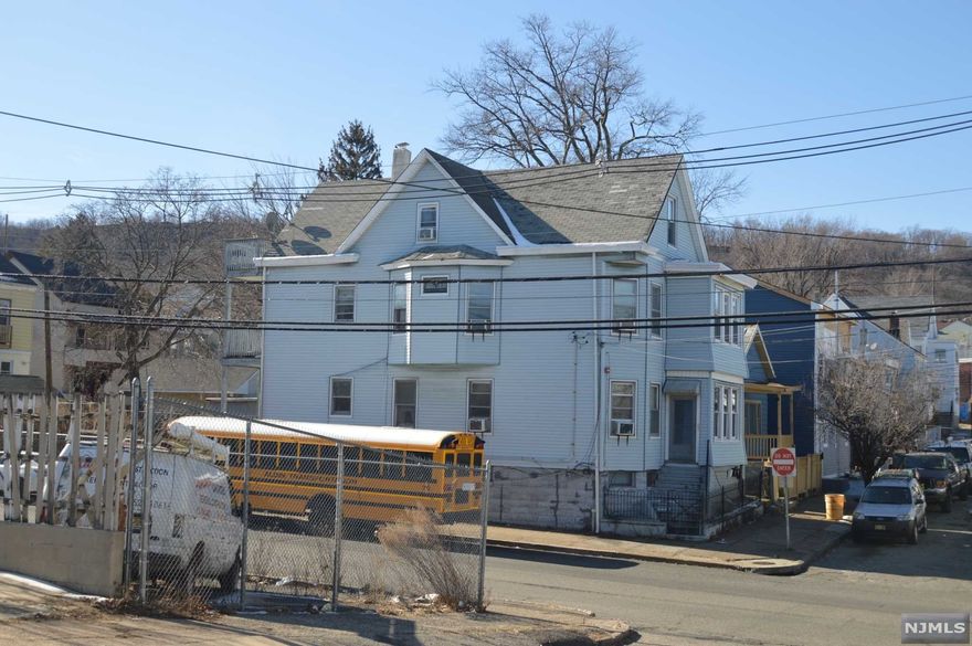 A fully rented legal 3 family house in Atlantic St, Paterson, NJ. All the tenants are on month to month lease. All the tenants are long term tenants. Separate utilities for all the apartments. The house is well maintained and well taken care. This house is equipped with State Mandated Fire monitoring alarm system.