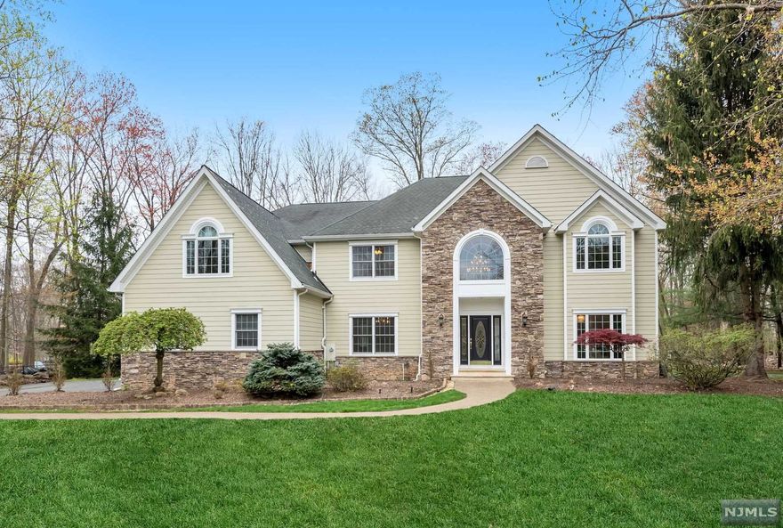 Location, location! Wonderful opportunity to own this spacious 5+ bedroom, colonial with pool. Nestled at the end of a quiet cul de sac within easy walking distance of all, on a large level property. Inside, a double height entry welcomes you inside with an office/library on the right & formal dining room & butler's pantry on the left. A spectacular double height family room enjoys views over the large entertaining patio & pool. The eat-in kitchen with island has newer appliances, 2 pantries & easy access to the attached 3 car garage. A first floor BR & full bath round out this level. Upstairs, find 4 more generous bedrooms including 3 with ensuite baths. The finished lower level adds more living space with a wet bar, recreation rooms, half bath & more. Close to top-rated schools, Crestwood Lake, NYC train & more.