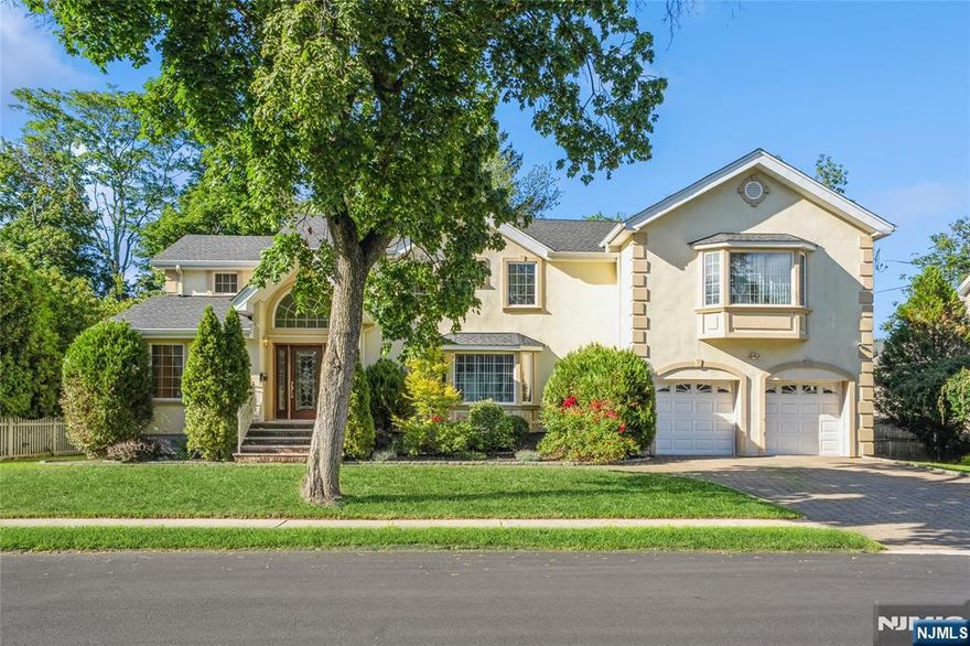 Rebuilt in mid 2000's. This Beautiful Colonial home features a huge living room with a fireplace, separate formal dining room, recessed lighting, hardwood floors and Sliding glass doors to a spacious deck. The second floor features a large master bedroom with a walk in closet, master bathroom with Jetted tub and spacious wide hallway. A finished basement with ceramic tile floor completes this home with additional recreation room and full bath. For your convenience this home is equipped with an attached 2-car garage. Brand new roof installed less than 1 year ago. Conveniently located to schools, playgrounds and park on a 1/4 acre lot. The listing agent has a relationship with the owner.