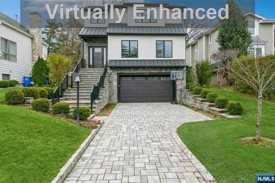 This 2019 home in beautiful East Hill Tenafly, brings together style and practicality. With high ceilings and a big, two-story family room, it feels open and welcoming. The layout connects a large kitchen, featuring a butler's pantry and large pantry closet, directly with the living areas, making it great for cooking and spending time together. Upstairs is designed with families in mind, including three bedrooms, two full baths, and a laundry area. The primary bedroom is spacious, with big closets for two and a stunning primary bathroom. The basement adds more space with 9-foot ceilings, a bedroom, bathroom, wet bar, and a large area for fun or relaxation, making it a flexible part of the home. Located in a sought-after part of Tenafly, the house has a big backyard and is close to schools, downtown, and bus routes, offering both peace and convenience. It's a home made for comfort, smart design, and a great location, ready for new memories.