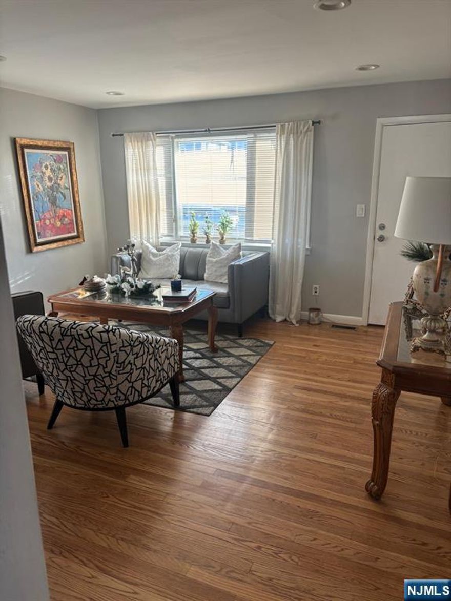 This beautiful expanded ranch designed with two entering. On your right the layout consists of a living room, eat-in kitchen, two spacious bedroom and a full bathroom. A hallway leads to a finish walk-out basement with a complete addition bathroom offering extra living space for relaxation and enjoyment. Walking out to a private fenced back-yard, perfect for relaxing or entertaining. Property also includes a detached Garage and driveway up to three cars. Returning to the front entrance and entering thought the left door, a staircase leads to private upper-level suite. This space features a bedroom, a cozy family room and a full bathroom for extra space.