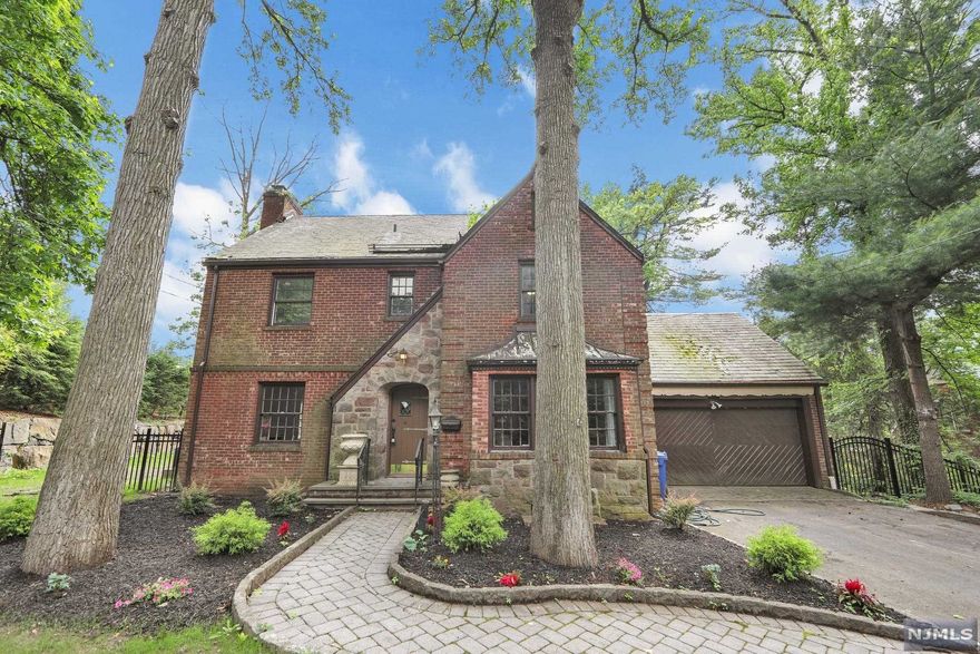 Location, location, location!! This stately Tudor style home is beautifully appointed and in move in condition. Home is loaded with character and modern updates. This home features an entrance foyer, formal living room with fireplace, large dining room, updated gourmet kitchen with high end appliances (Viking, Wolf, Subzero), family room addition with an abundance of windows overlooking the park like rear yard, half bath, laundry & 2 car attached garage. Second floor has master bedroom/master bath with large walk in closet, 2 additional bedrooms and 1 additional family bath. Third floor has 1 bedrooms and 1 full bath. Basement is finished with a full bath. Timeless slate roof. Gorgeous neighborhood, VERY close to public transportation and houses of worship! Not to be missed!! Virtual Tour Link https://my.matterport.com/show/?m=amZRw1ugrkL