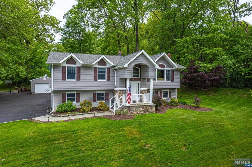 mmaculate, Bright Custom Bi-Level. Quality craftsmanship and fine detailing throughout. Located on Corner lot in a quiet Neighborhood. Lots of Generous Room Sizes to Spread Out & Make Your Own! Layout offers versatile options! GREAT house for entertaining or everyday living. Large living room w/big picture window offers tons of natural light. Recently renovated custom kitchen. Granite countertops, maple cabinets, stainless steel appliances & separate dining area. Lovely sitting area w/matching granite desk & built ins. 3 large bedrooms & 2 full bath upstairs includes the primary suite w/bath & walk-in. 4th bedroom on lower level. Fully equipped w/powder room, office space & laundry/mudroom that walks out to the backyard. An oversized family room w/WB fireplace adds character while helping to keep the house warm & cozy in the colder months. Over 2600 square feet. 2 car garage attached with inside entrance & 3rd bonus detached garage. The backyard is beautifully landscaped.