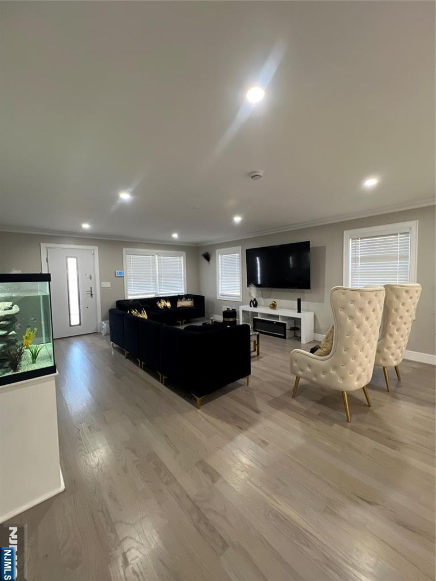 New construction completed!Dream Location! This new constructed duplex is located in the heart of the prestigious Hasbrouck Heights, just steps away from restaurants, schools and house of worship. Home offers a perfect combination of elegance and functionality. This residence boasts a first level that includes a spacious garage, utility room, convenient half bathroom, and a welcoming family room with a walk-out slider leading to the backyard. The second floor of this home is designed with an open concept layout. Living room, kitchen, butlers pantry, coat closet and powder room. Third level, you will find three generously sized bedrooms, offering comfort and privacy. The master suite includes an en-suite bathroom, while the two additional bedrooms share a well-appointed bathroom. A laundry room is conveniently located on this floor, providing ease and efficiency. Additionally, there is a spacious office that can serve as a versatile space, office or a nursery