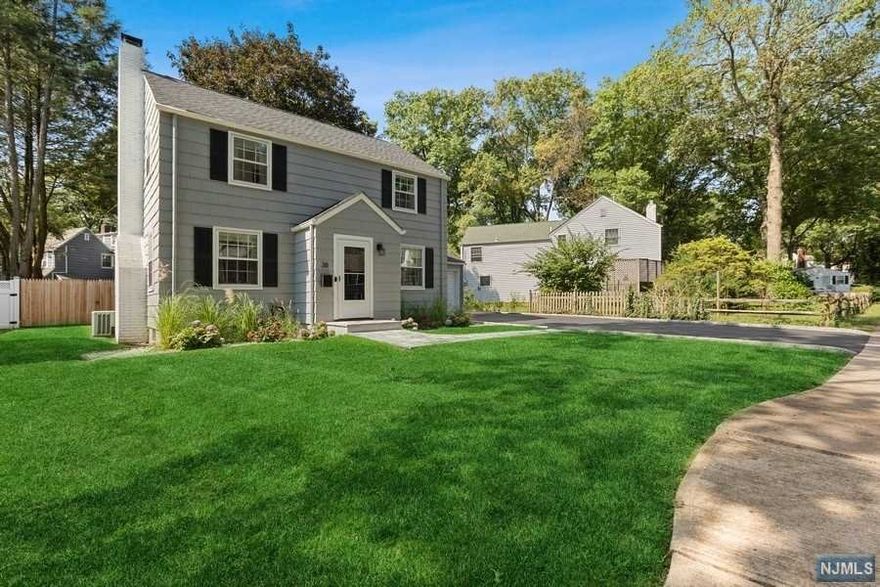 Tucked away on a quiet, tree-lined cul de sac in the sought-after "Fieldstone" section, this completely renovated Up Montclair mid-century Colonial awaits. Steps to Bonsal Nature preserve & NYC bus. Improvements include new kitchen featuring crisp white cabinetry, quartzite counters, farm sink & SS appliances, updated bathrooms, new front walk way, new fence, repaved & sealed drive way, new roof & freshly painted exterior. 1st floor offers living room with wood burning fireplace with custom mantel & barn door leading to completely renovated family/sun room perfect for home office or media. Formal dining room with chair rail detail, renovated kitchen, & updated powder complete the first level. On the 2nd level are 3 sundrenched bedrooms & updated full bath. Basement houses laundry & has tons of storage space. The huge backyard is fully fenced & features brick patio. Upper Montclair shops & restaurants, Tuers Park, Applegate Farm Ice Cream, Yantacaw Brook Park are nearby!