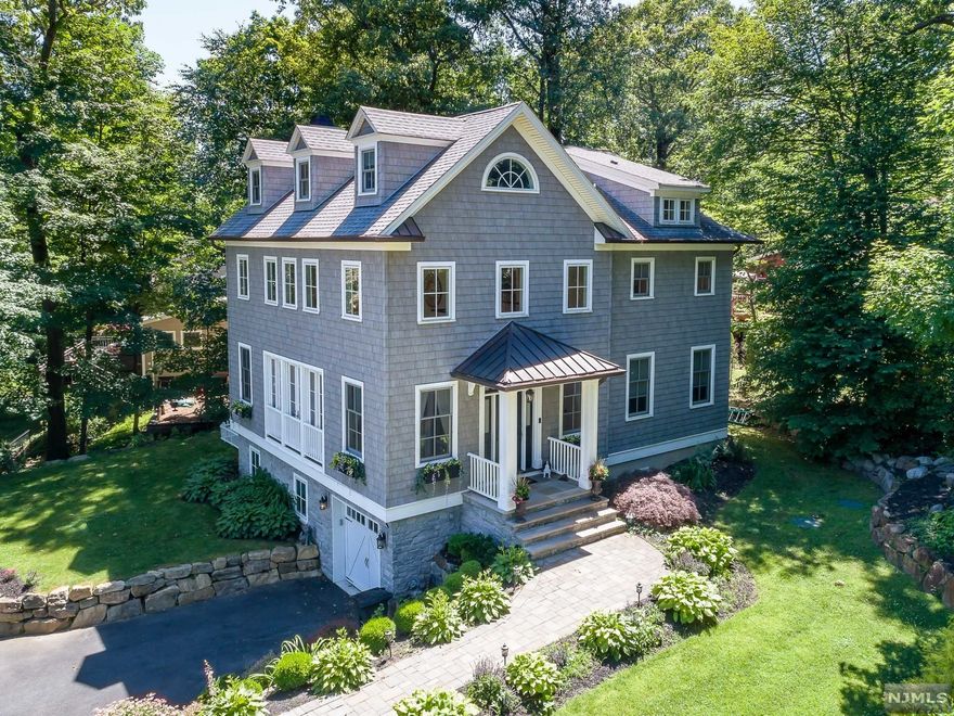 If you Are looking for a Million Dollar House with all the High Amenities on a Smaller Lot with Lower Property Taxes in A Wonderful Lake Community, than this is the House for you. This Stunning Custom Home was Built in 2016 with Seasonal Lake Views on a Quiet Cul-De-Sac. A 2 Story Dining Room Open to the 2 Story Great Room with Wide Plank White Oak Hardwood, Custom Crown Moldings. A Marble Surround Gas FRPL with a Custom Mantle. The Fabulous Modern Kitchen Offers a Center Island with a Marble Countertop, Farm Sink, Wine Refrigerator & Breakfast Bar. Custom White Cabinets with Soapstone Counter Tops, SS Appliances, Gas Range with 6 Burners, two ovens a Pot Filler & Mother of Pearl Backsplash with French Doors to a Trex Deck to Relax & Enjoy the Serenity. The upper Level offers a Primary Bedroom Suite with a Tray Ceiling & gas Frpl & Sumptuous Bathroom. Fin LL with Full Bathroom, Rec Rm & Music Rm. Swimming, Boating, Tennis and more. 2 Bedroom Septic.