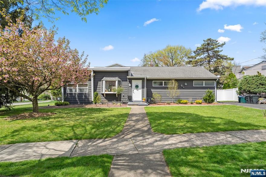 Beautifully maintained 3-bedroom, 3-bath home on a sought-after residential street near Cherry Hill Elementary School. Bright and spacious layout with a sun-filled living room, dining area with access to a private deck and yard, and a renovated eat-in kitchen with stainless steel appliances. A versatile family room can be used as a fourth bedroom or home office. The primary suite includes a private bath, with two additional bedrooms and an updated hall bath. Full basement offers a recreation room, full bath, laundry, and ample storage. Conveniently located near NYC transportation, shopping, and major highways.
