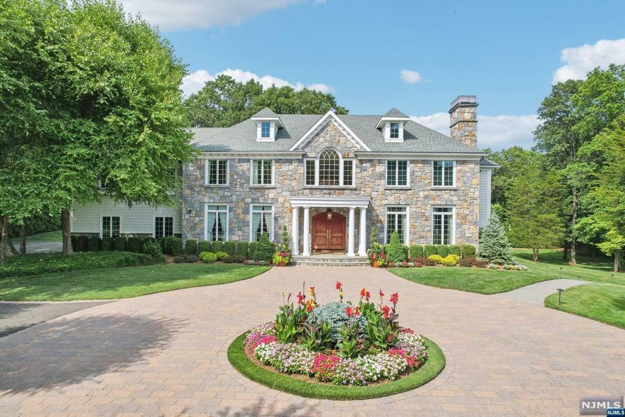 Discover luxury living at its best from this first time offered, elegant 6 BR, 6.5 bath colonial custom built by renowned builder John Avanzato on the street nominated most prettiest in Bergen County. Nestled on 2.5 picturesque acres, this magnificent home was completely updated in recent years. Every part of this meticulous home was professionally designed to bring the outside in & capture all of the surrounding natures beauty. The 1st floor features a designer kitchen w/top tier applicants, a light filled breakfast room, LR/FPL, FDR, Great RM/FPL, FR/FPL, BR/Office, bathroom & powder room. The 2nd floor has a luxurious primary bedroom with new spa like bath, 4 additional bedrooms, 3 newly updated bathrooms & laundry. Finished lower level features a home theatre, a full kitchen, Rec RM, play RM, Gym, BR, Bath & a 2nd lndry. The beautiful grounds are complimented by bountiful gardens, a salt water pool, fountains and an all season covered & heated porch w/ built in outdoor BBQ